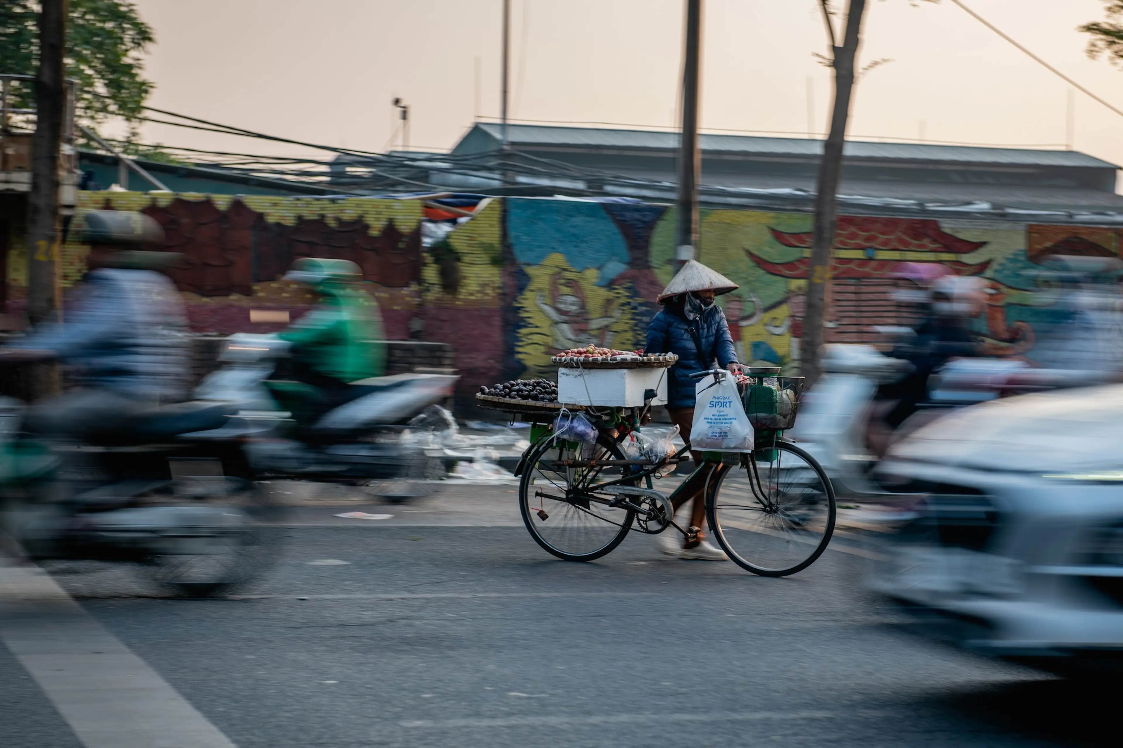 Crossing the road in Hanoi - capital of Vietnam