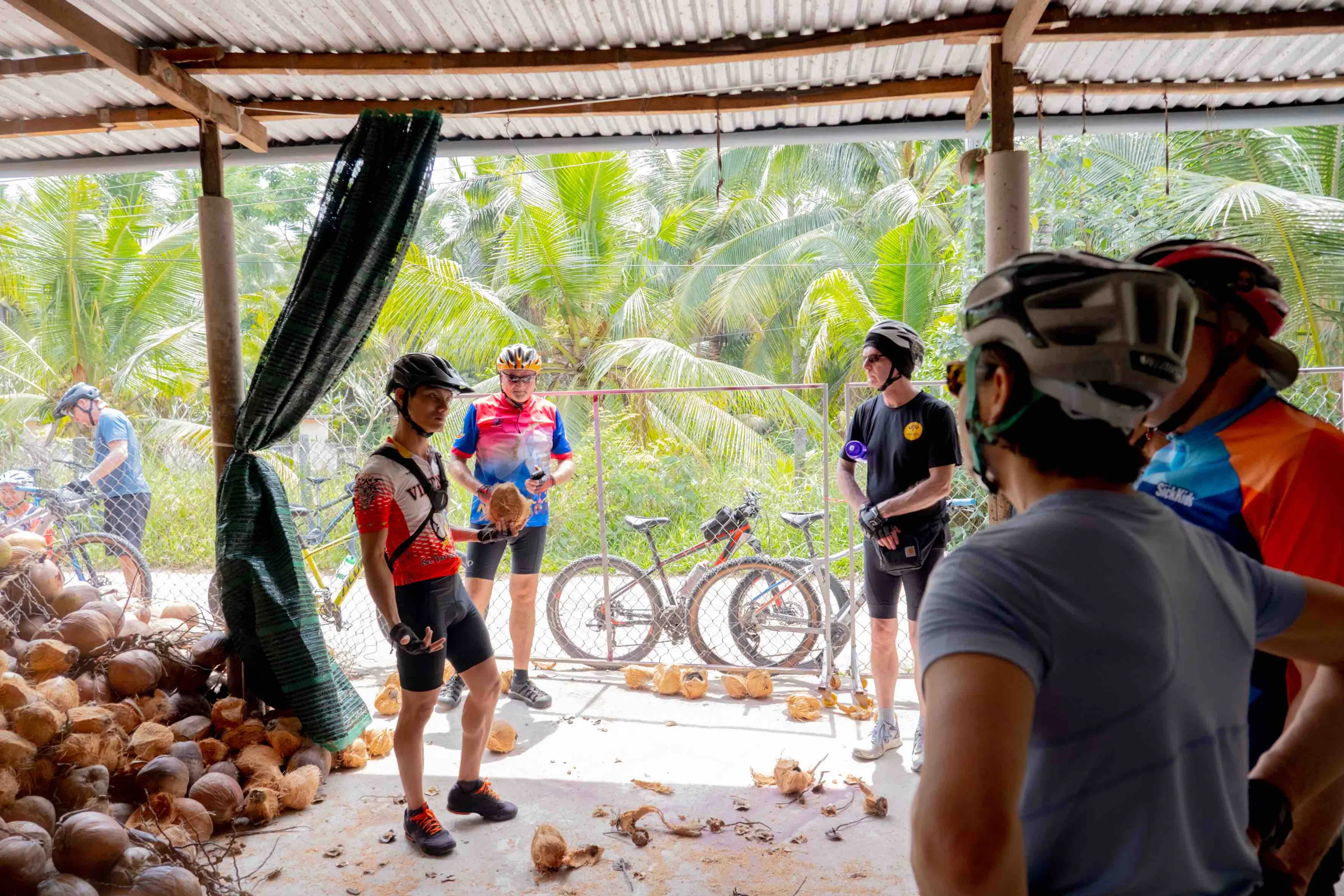 Our Mekong Bike Trips always stop at a local coconut farm for relaxing and enjoy truth "Mekong Cuisine"